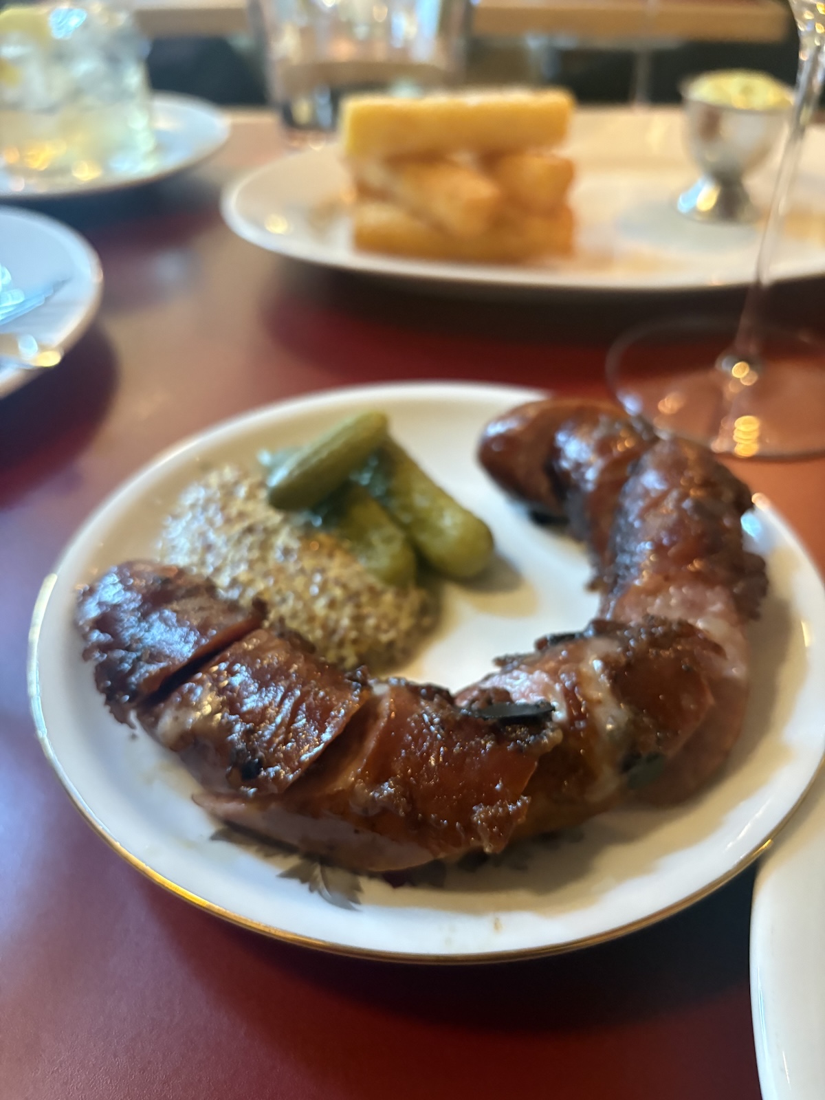 Käsekrainer sausage with cornichons and grain mustard at Donauhof, Vienna