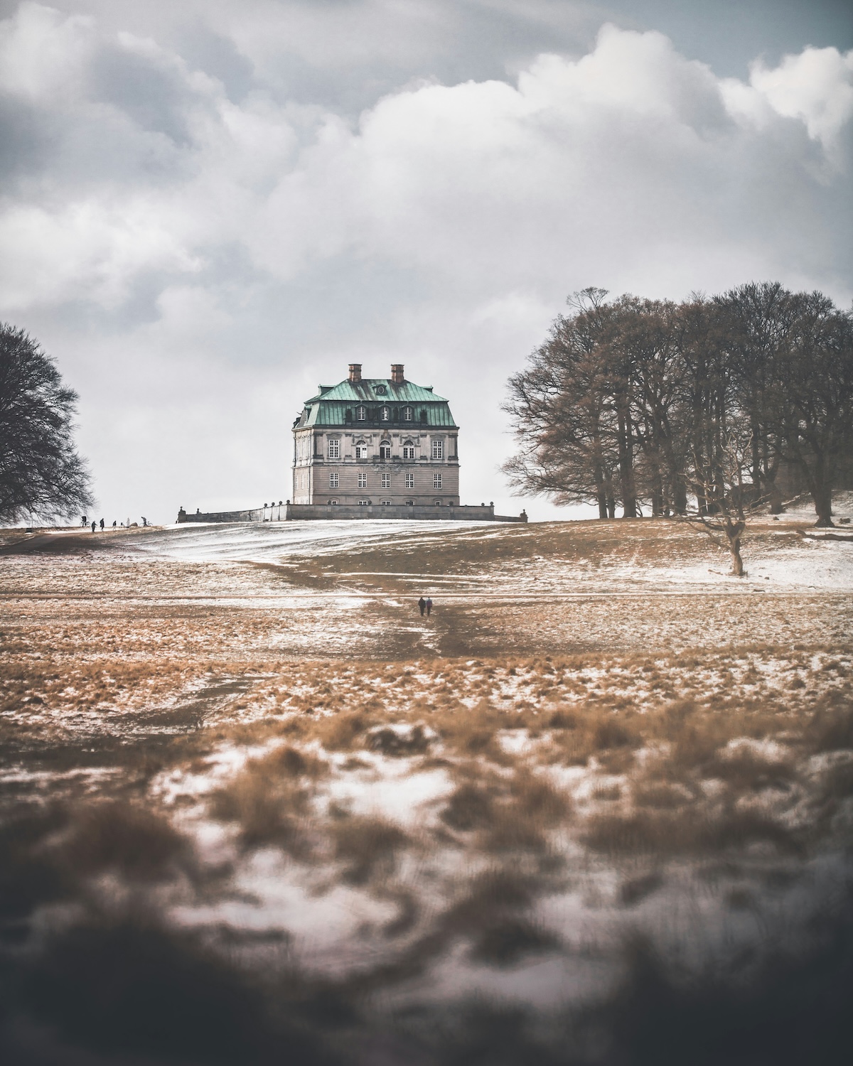 The Baroque Hermitage Palace on a snow-dusted hill in Jægersborg Dyrehave deer park near Klampenborg.