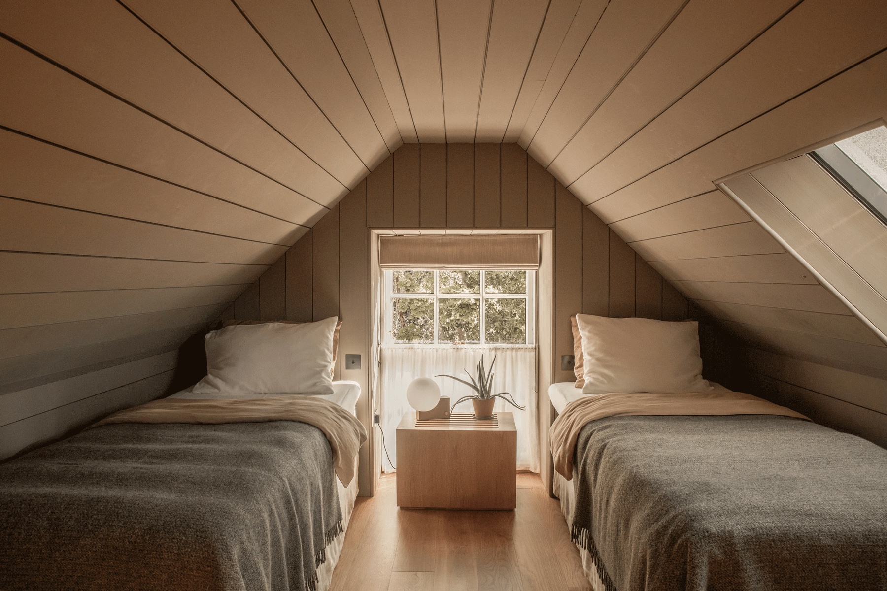 Luxury loft Bedroom Suite in oatmeal paints +natural linens  - Scandi-Scot interior design as found at Lundies House Sutherland Scotland