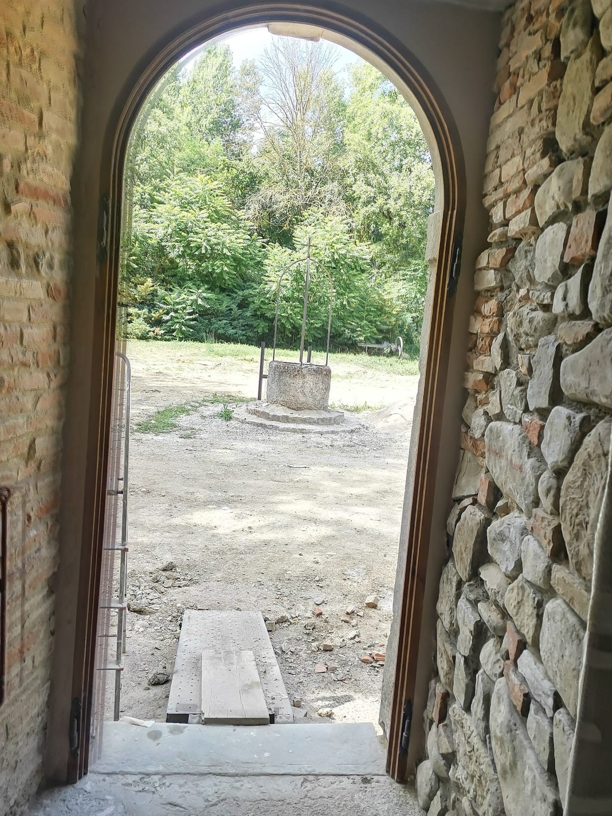  Cloister design and architecture -a stone archway Vocabolo Moscatelli: A 12th-Century Monastery Reborn as a Boutique Design Hotel in Umbria
