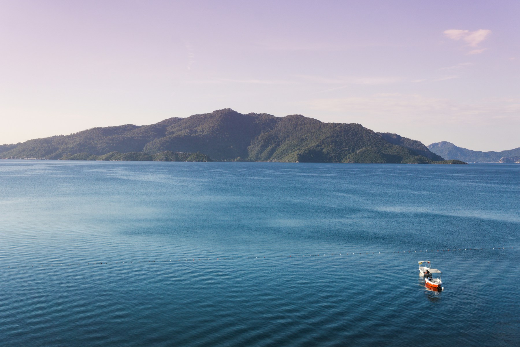 Blue Turqoise Aegean See on Turkish Riviera, small distant island |Untamed Beauty of Türkiye’s Riviera: A Journey Through Ancient Bays and Forested Shores