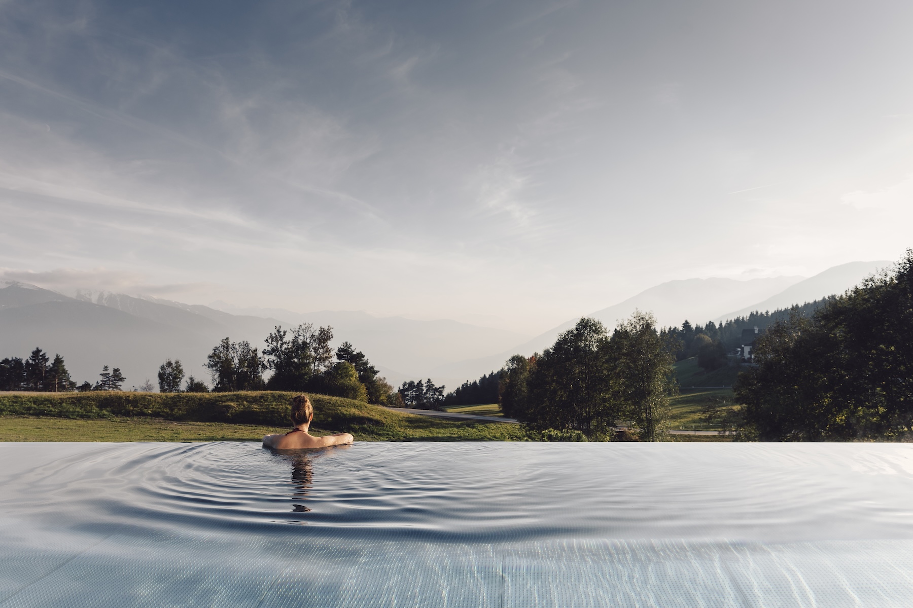 Swimming pool, indoor, natural light, full length glass panes of the forrest | Vigilius Mountain Resort South Tyrol |Stylish Travel to Italy: Boutique Hotels, Design Stays & Culture