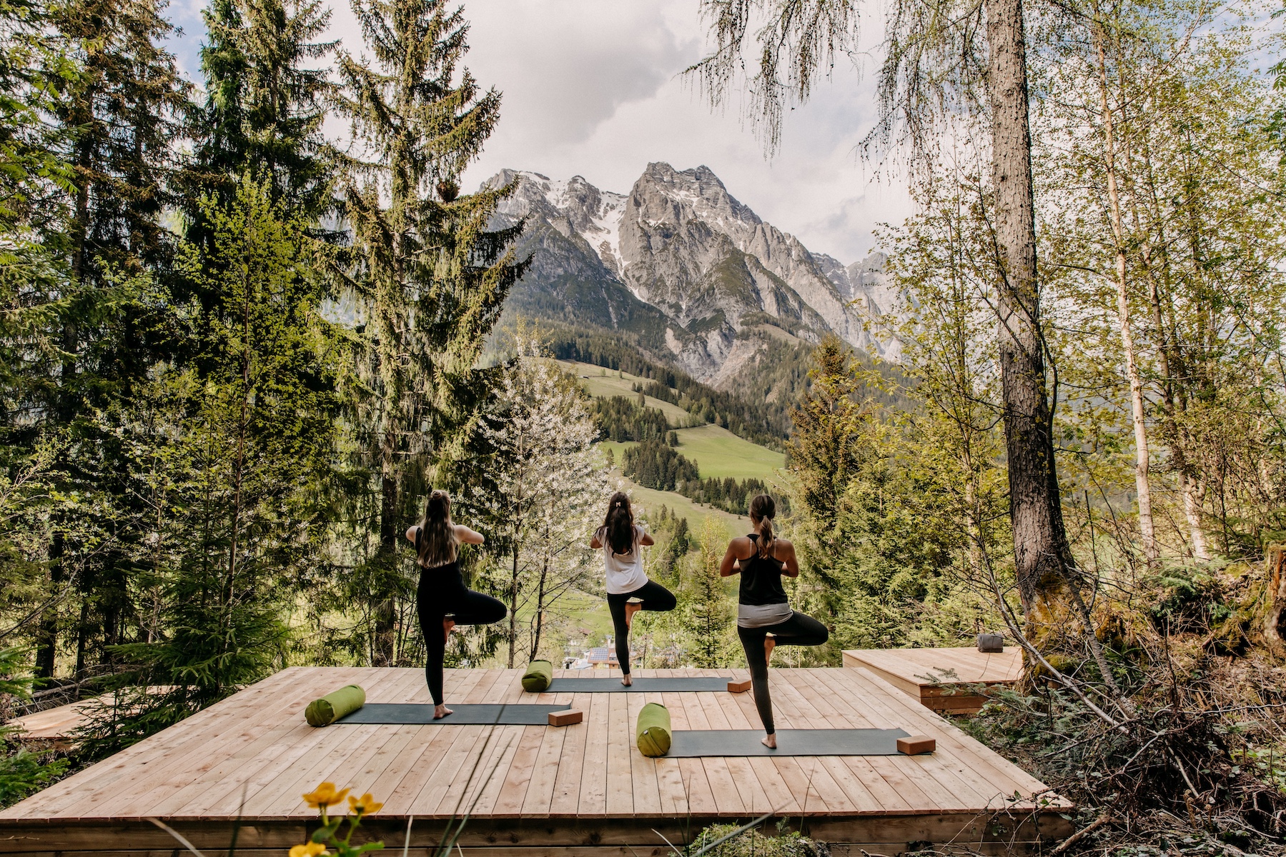 Open air Yoga in the forest at Design Hotel Forsthofgut & Spa, Leogang, Austria