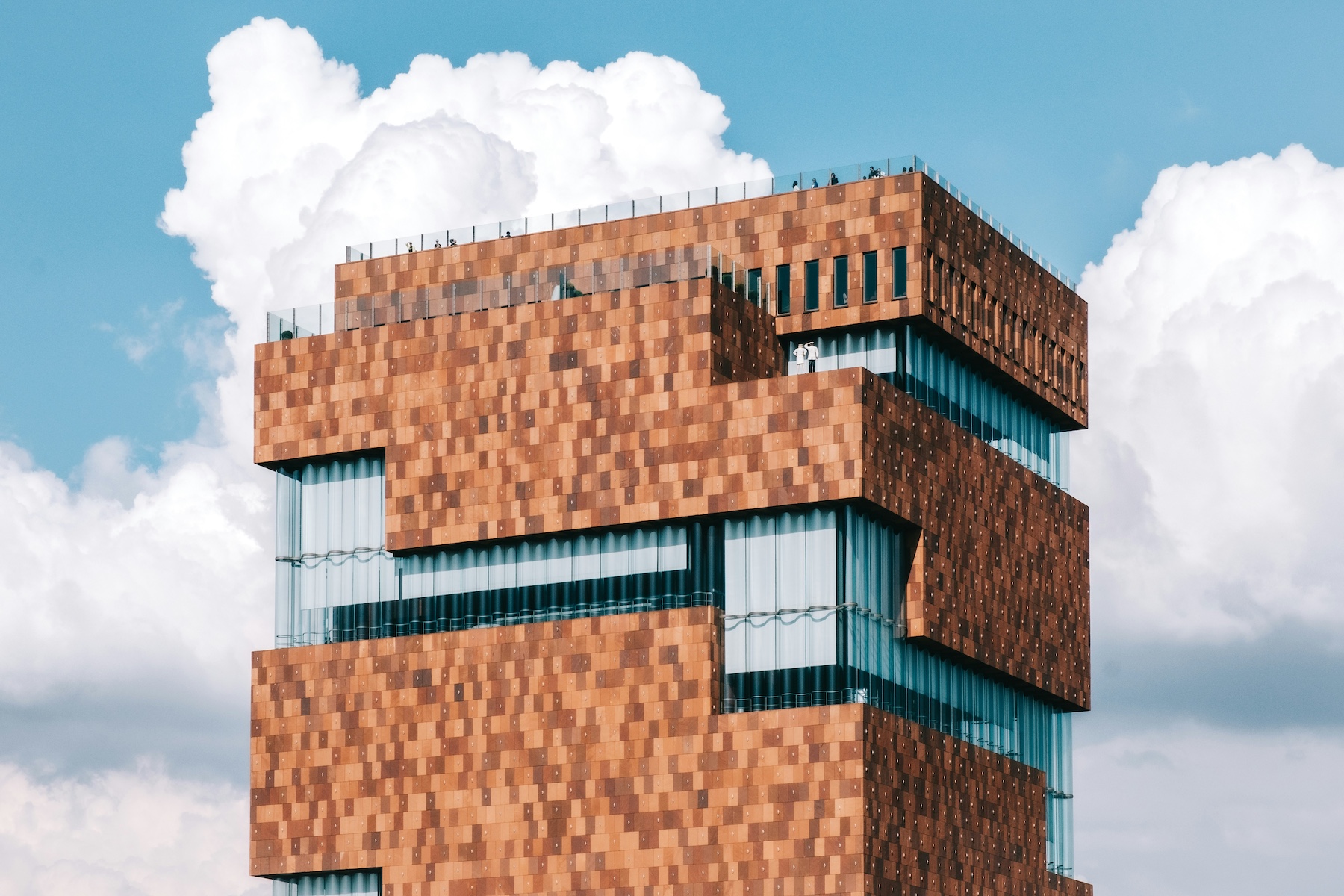 Abstract red brick architecture against blue skies | MAS Antwerp: Architecture, Culture and Global Collections in the Eilandje District