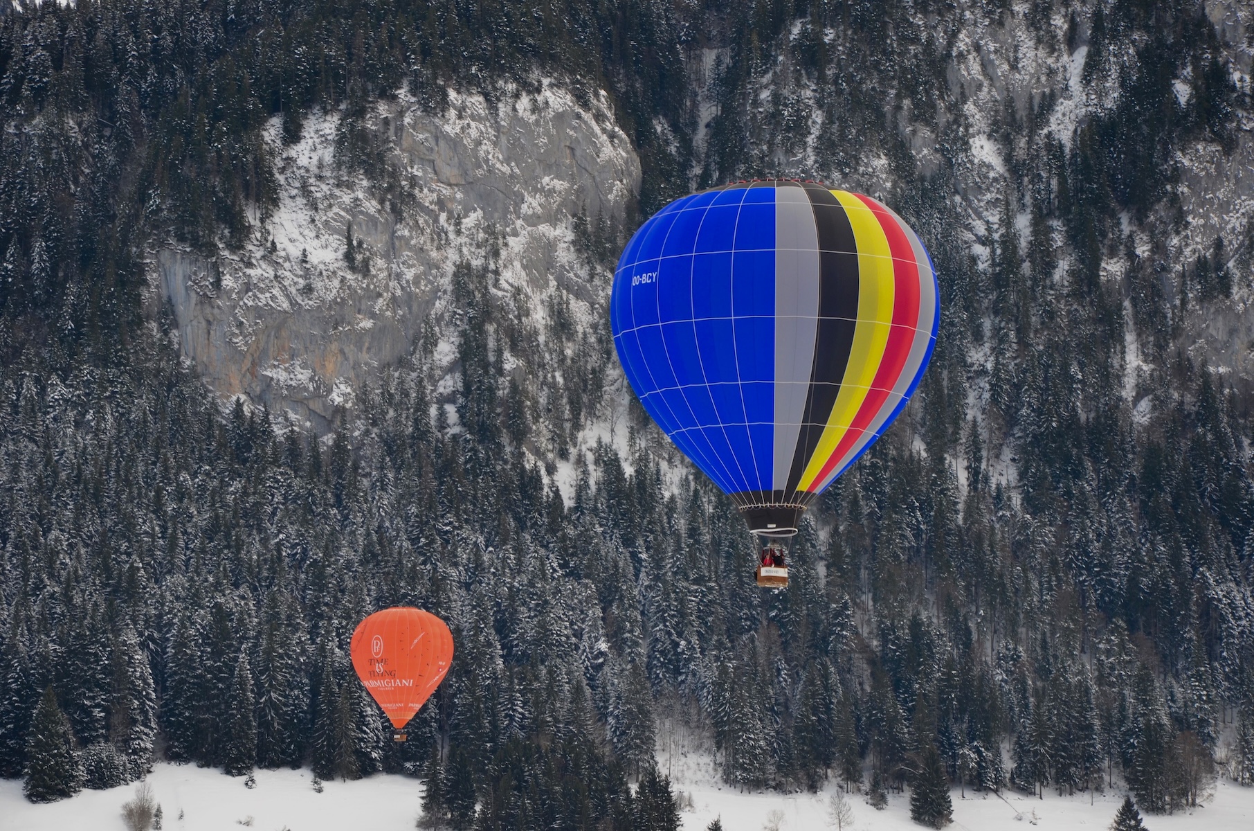 A colourful photo of Switzerland's famous hot air balloon festival and balloons in it