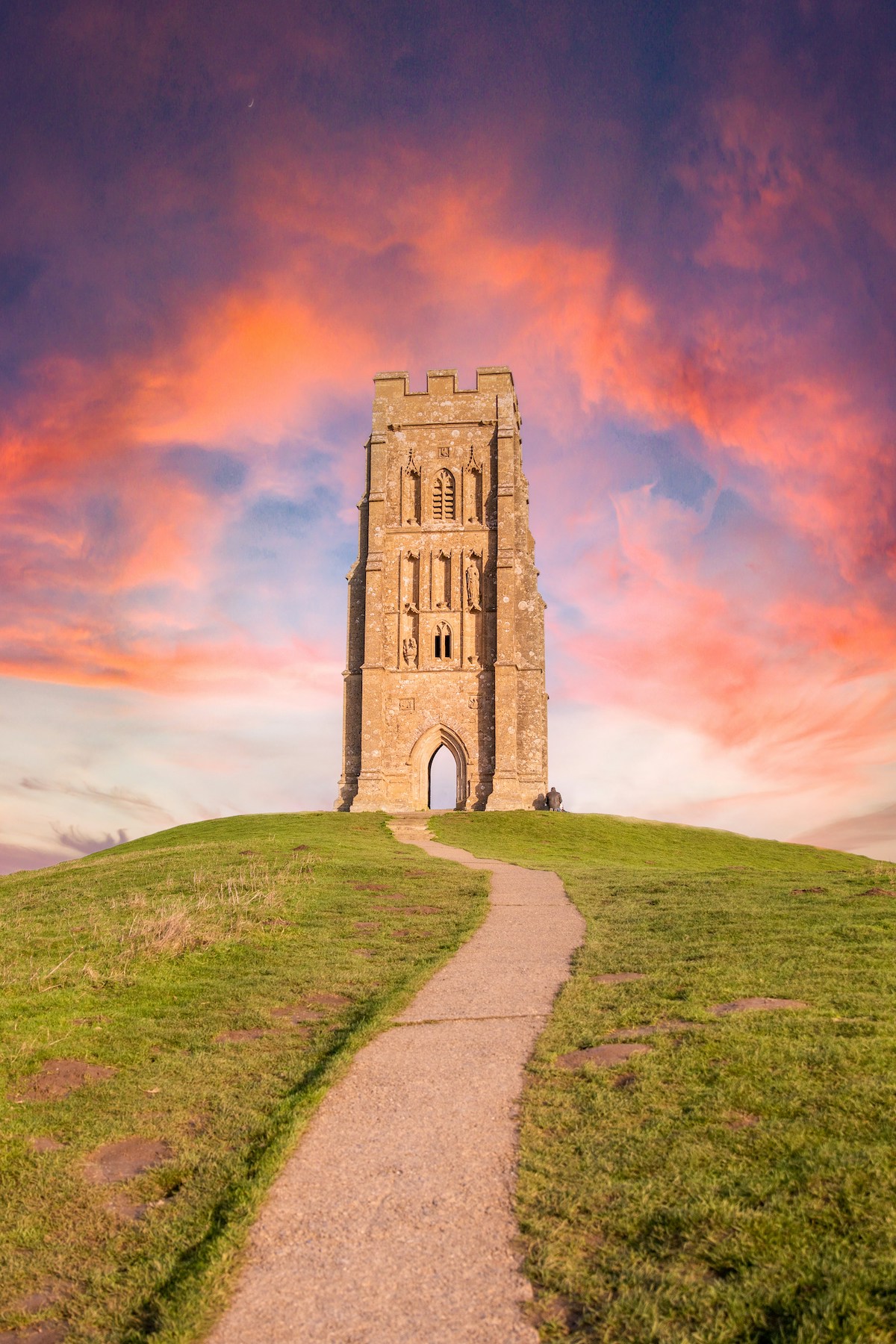 A lonesome tor, chirch towers against beautiful sunset reds |Somerset England: Heritage, Food, Willow Weaving, Arts, Cider and Creative Culture