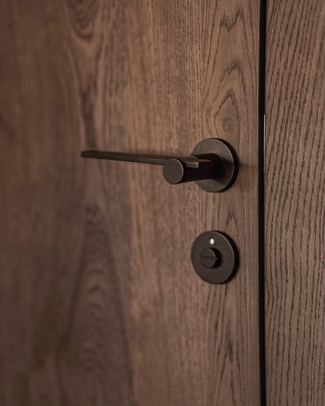 Traidtional Alpine Timber Door and steel iron latch - elements in hotel reincarnation| Restoration Culture | Architect Carolyn Sarah Herzog | Studio H Collective | Design Hotel Stieg'nhaus Austria 