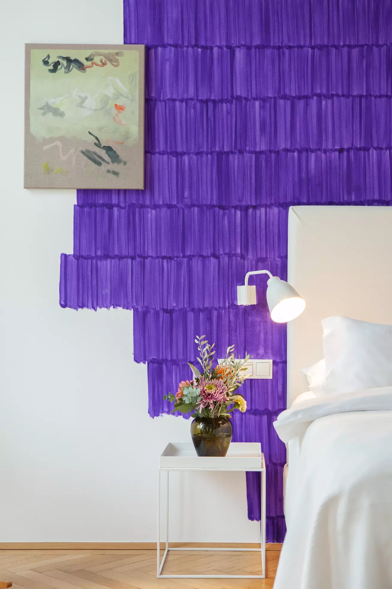 Fabulously creative Bedroom Interior design with deep purple colour blocks applied to a white wall | Atlstadt Hotel Vienna Austria |The Art of Desking: Stylish Hotels for Work, Rest & Play – The Aficionados