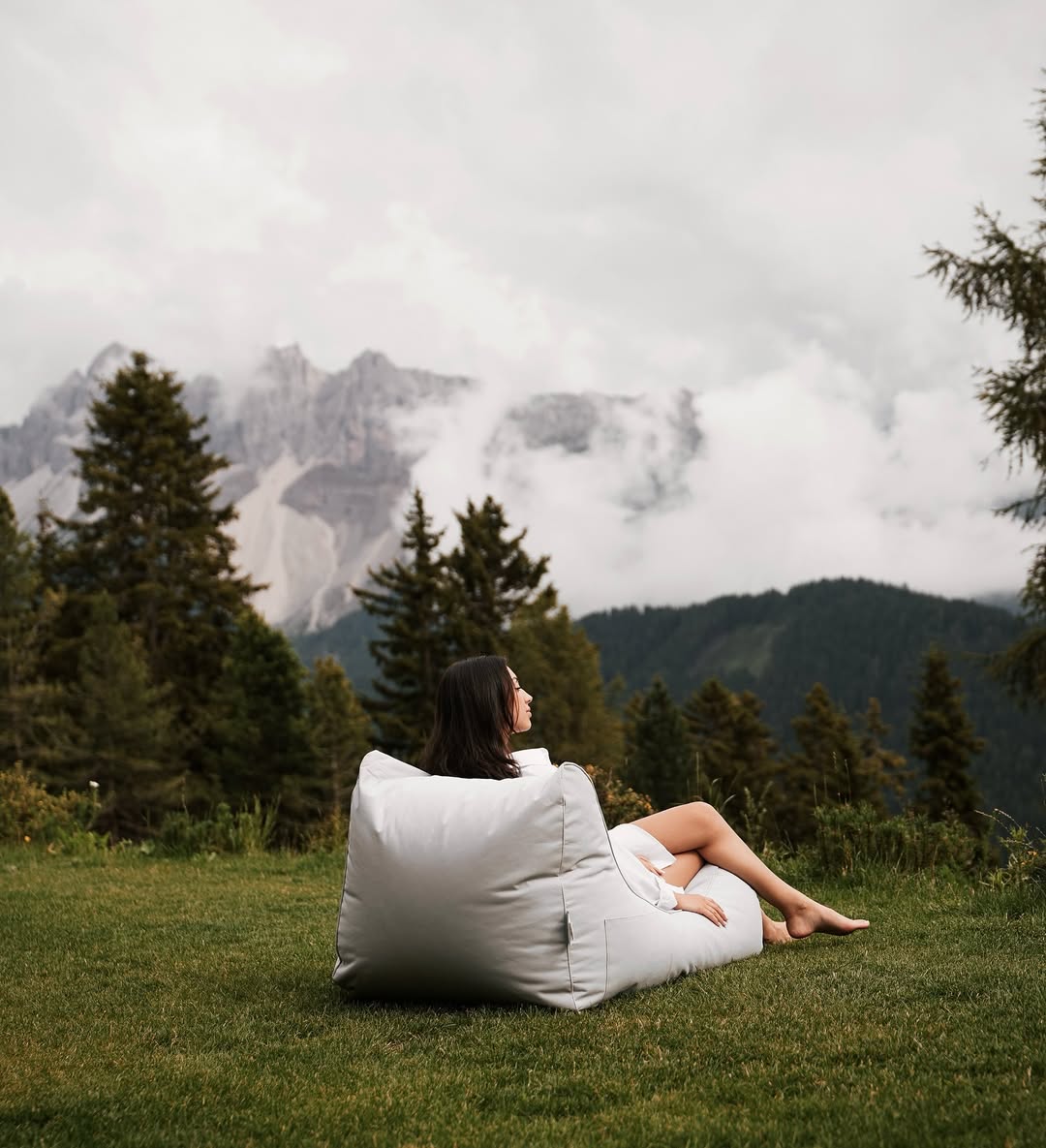 Guest on the alpine meadow watching cloud break over the Dolomites at 1,850 metres | Anders Mountain Suites, Plose, South Tyrol, Italy | The Aficionados