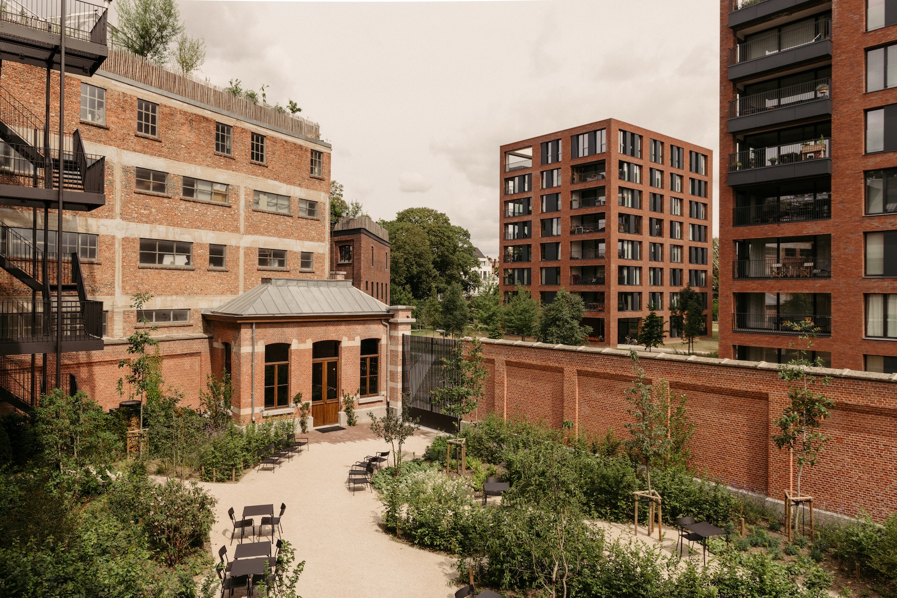 The restored Augustinian convent and its gardens, with Antwerp brick beyond, at August | The Aficionados