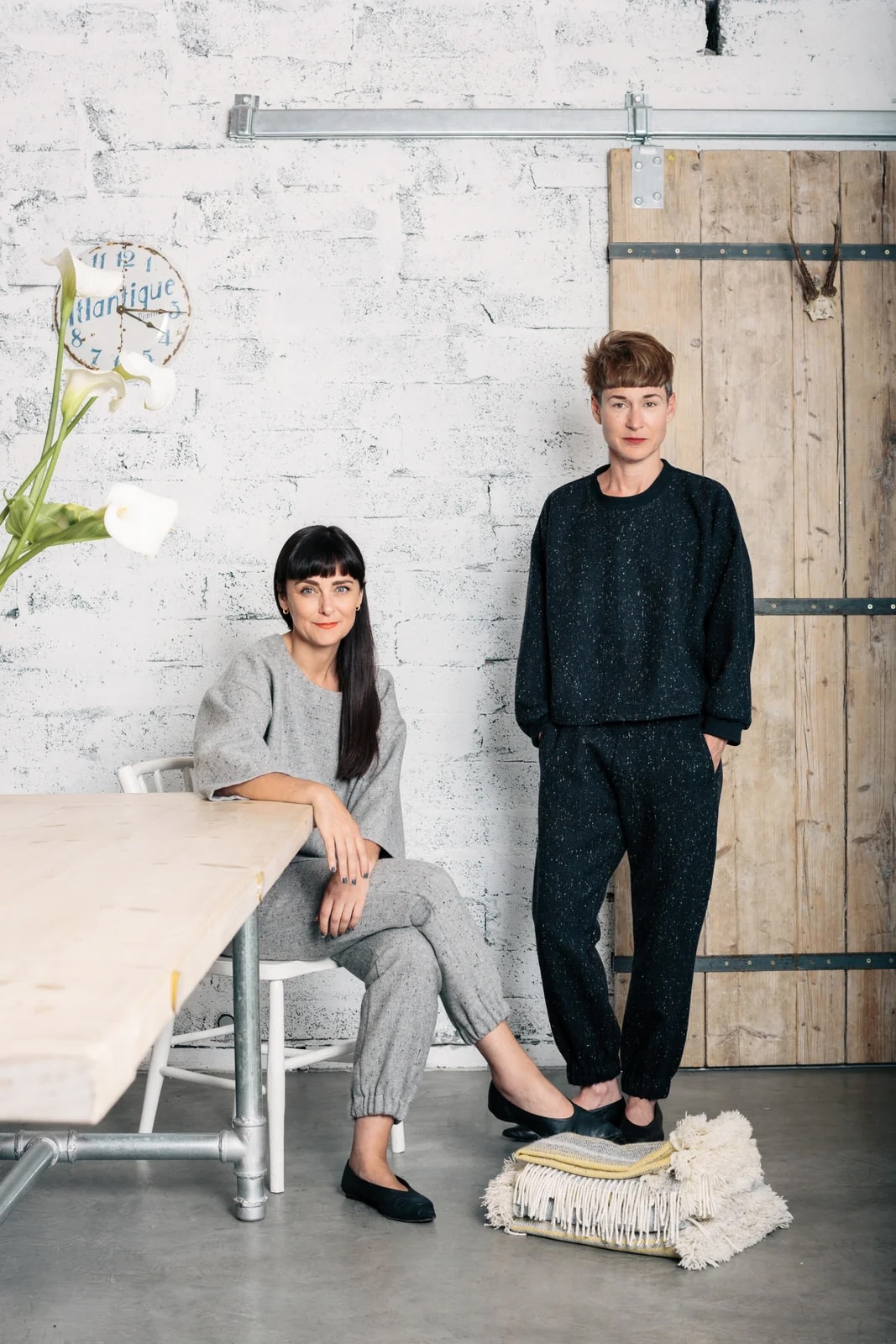 The Tweed Project founders Aoibheann McNamara and Triona Lillis in their whitewashed Galway atelier, with an 