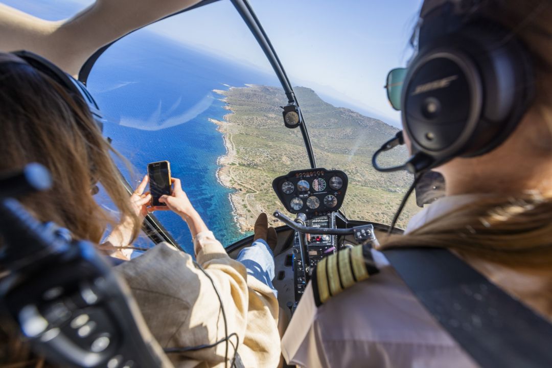 Pilot and Passenger cockpit helipcopter trip over the Aegean Sea in Greece  |Greek Island Hopping by Helicopter: Fast-Track Culture & Design | HOPER Helicopter Airlines