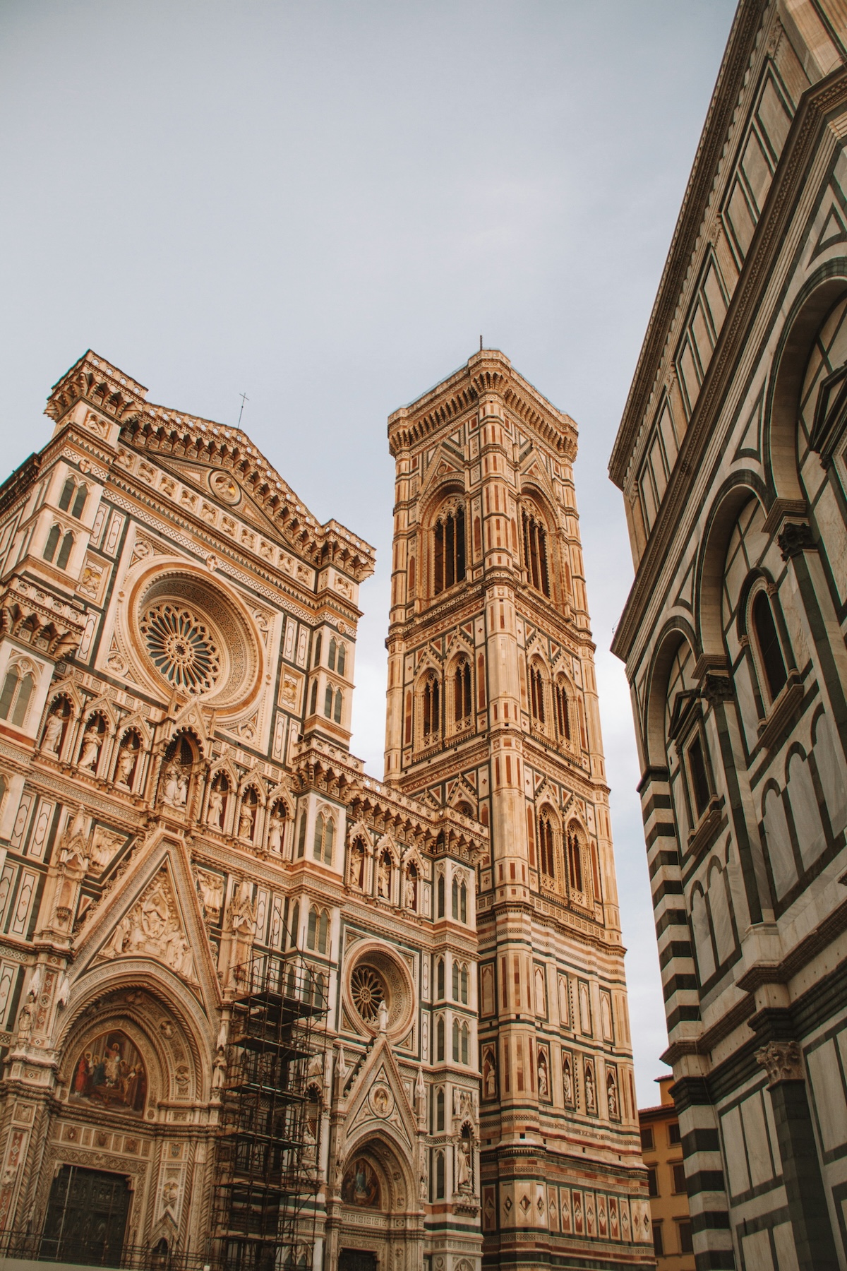 The polychrome marble façade of Florence Cathedral and Giotto's campanile seen from the piazza below | The Aficionados
