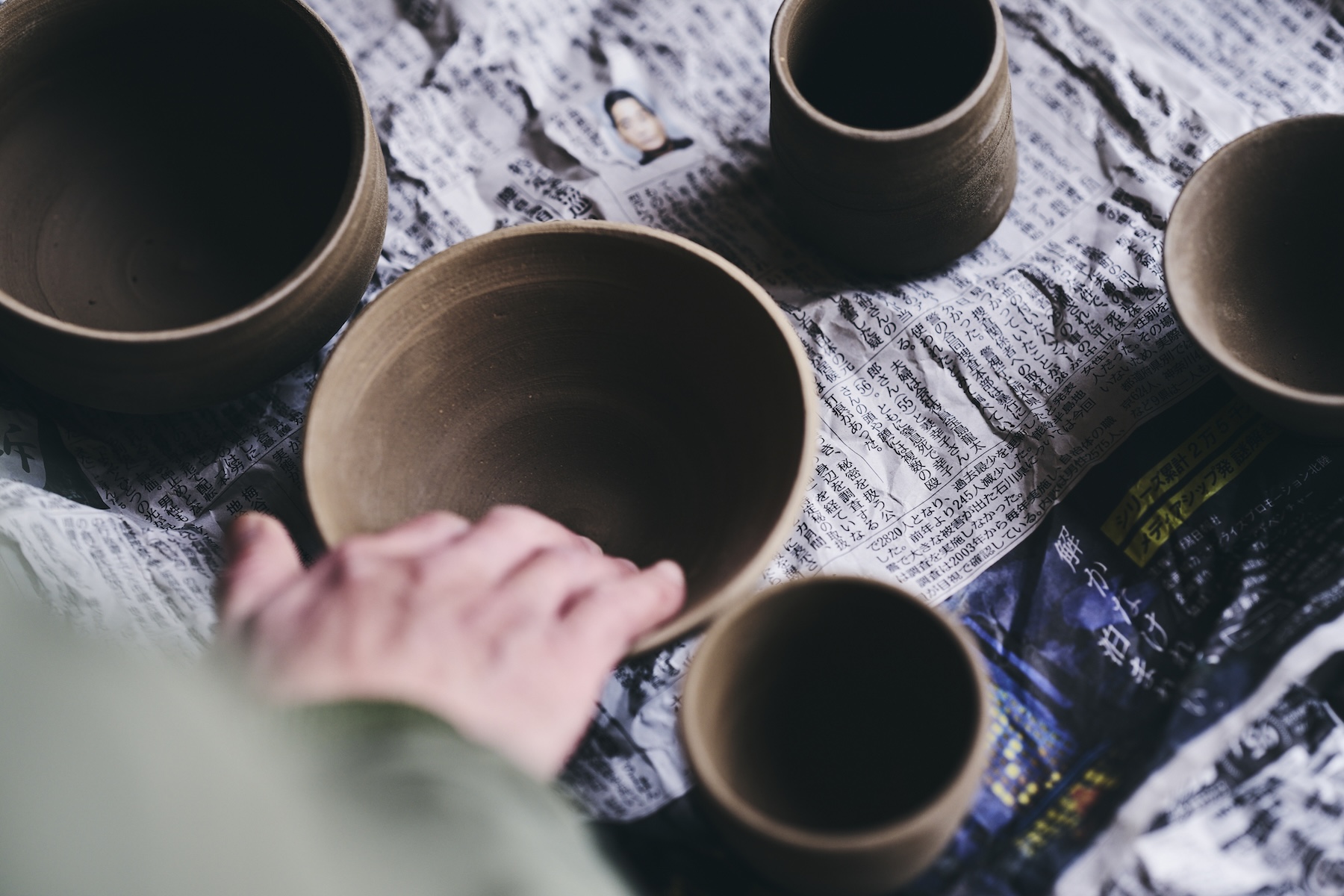 Hand-thrown ceramic tableware at Né, earthen tones echoing the auberge's soil walls, Shibata, Niigata, Japan | The Aficionados.