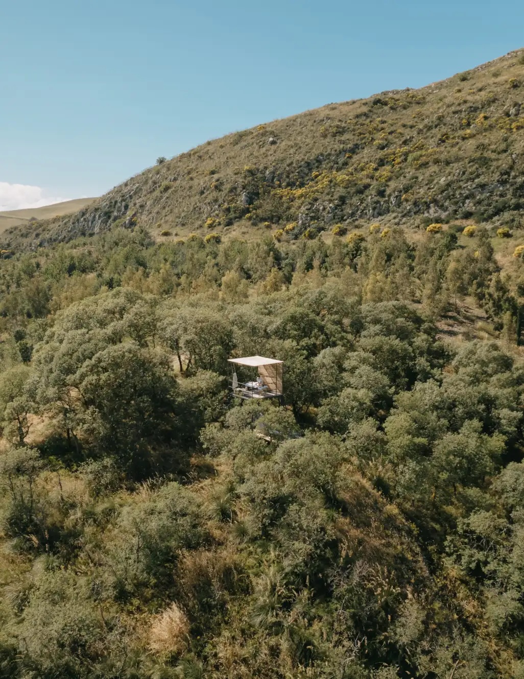 Open-sided pavilion tucked into the Mediterranean woodland of the Susafa estate, the five-hundred-hectare working farm and eco retreat in the Madonie foothills above Polizzi Generosa, Sicily | The Aficionados.