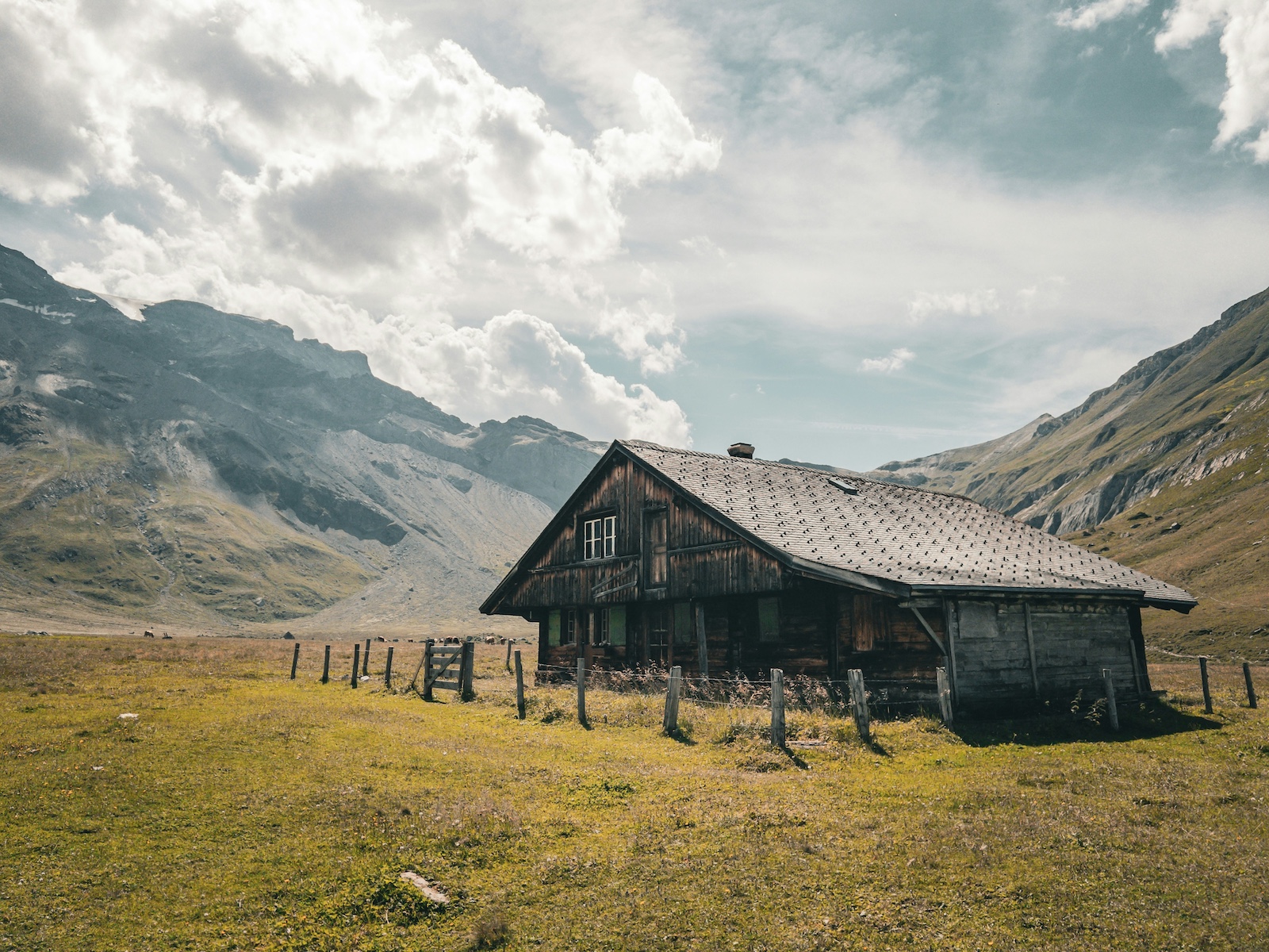 Rural Farmhouse in the folds of the Bernese Alps in Switzerland Typical village construct in dark timbers . Engstligenalp: A Limestone Plateau of Alpine Silence & Legacy in Adelboden