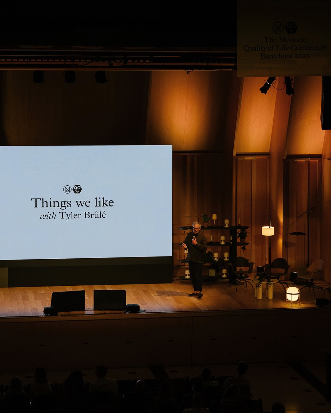Monocle editorial director Tyler Brûlé on stage with a microphone during his 