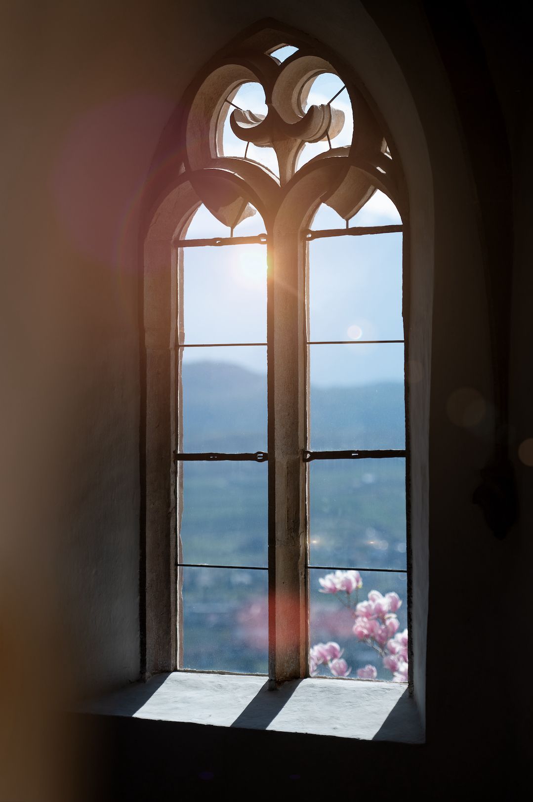 Sun light casting of a medieval window castle architecture | The Art of Desking: Stylish Hotels for Work, Rest & Play – The Aficionados